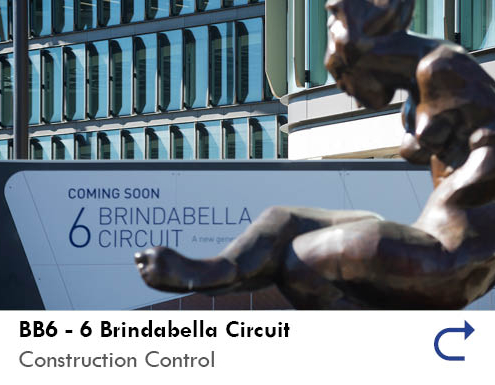 Link to the BB6 - 6 Brindabella Circuit project feature by the Australian National Construction Review. Image shows the windows of the BB6 project in the background and the main white sign for the project with '6 Brindabella Circuit' printed on in blue.